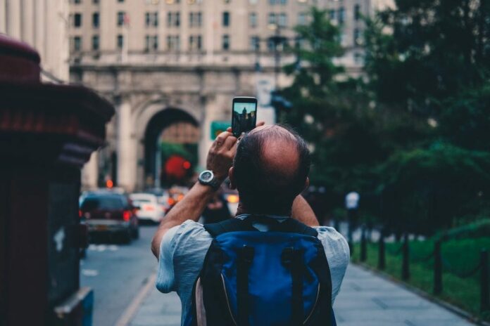 Man taking photo on his mobile phone