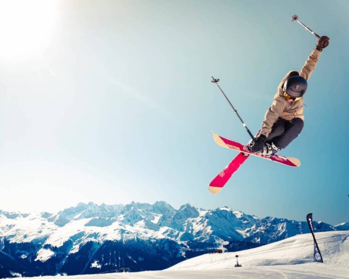 Skier airborne on the snowy slope