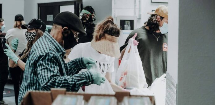 Man and woman holding bags of food