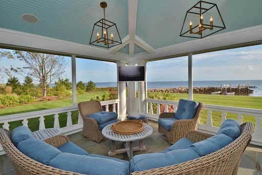 Enclosed patio space facing waterfront lawn