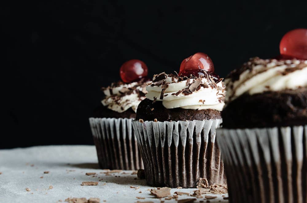 Chocolate cupcakes sitting in a row