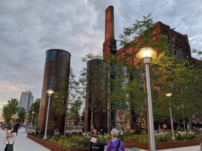 Pedestrians walking by the Domino Sugar Factory