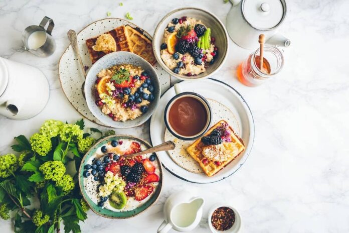 Plates of brunch items on a table