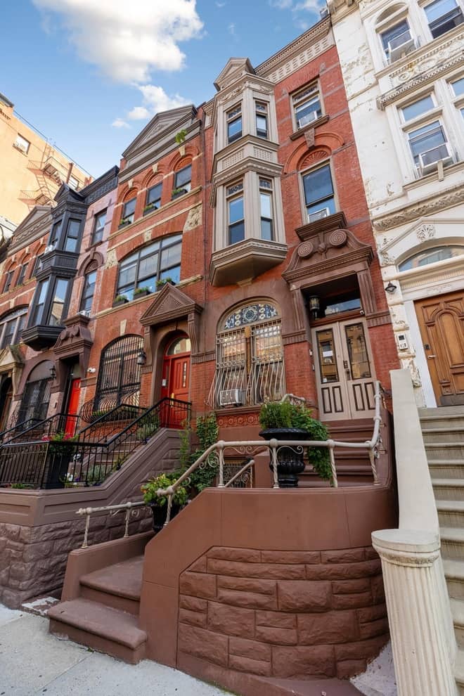 Building facade of brownstone at 210 West 122nd Street