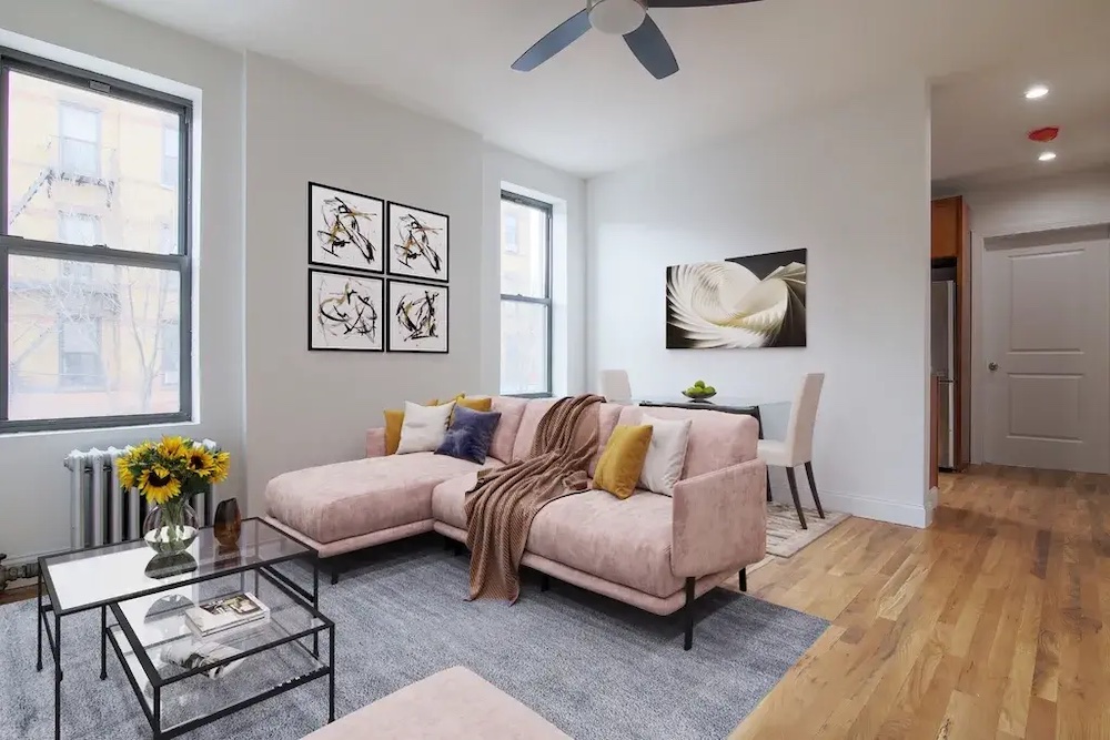 Rental unit living room with couch, coffee table, and rug