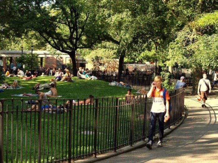 People lounging and walking around Tompkins Square Park