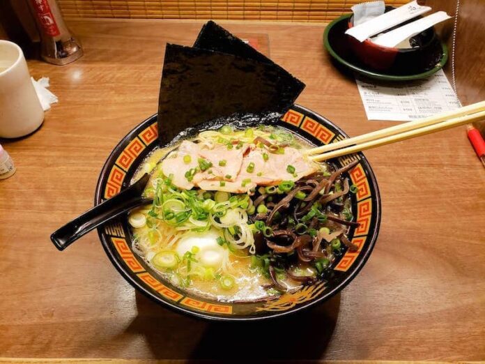 A bowl of ramen on a wooden table